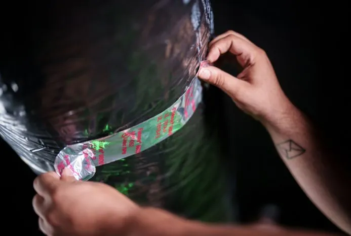 View of an Air duct being taped by a professional technician.