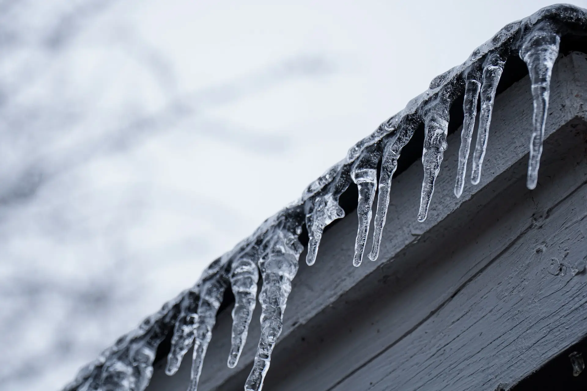 Icicles hanging on the edge of a roof
