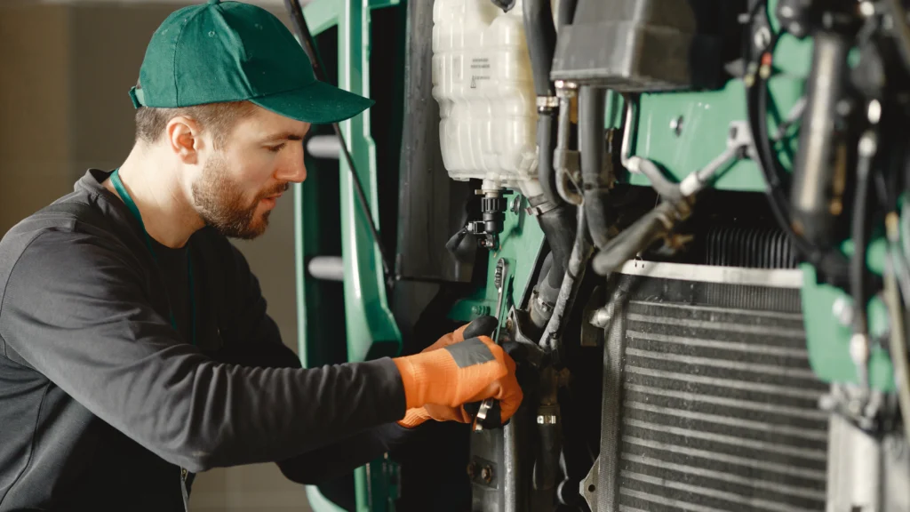 Image of an HVAC technician inspecting and cleaning an air conditioner filter to diagnose why the AC stopped working.